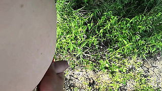 Naked man is surprised while peeing in nature and gets a helping hand