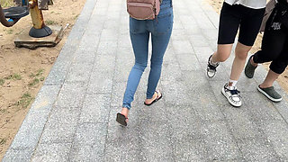 Public Wetting Jeans in Park Near the Beach