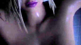 She rides a huge dildo in the shower