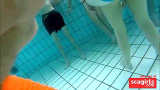 Girsl underwater at pool