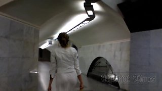 Upskirt without panties. Blonde in long white skirt.