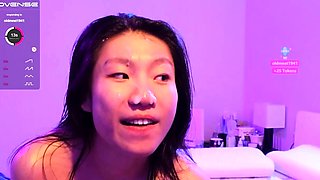 Small titted asian beauty giving blowjob