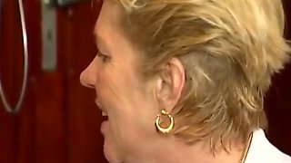 Horny Granny Spreads Legs In The Air As She Gets Fucked In The Office