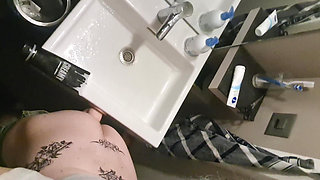 Crossdresser Pina in Bathroom Green Wig