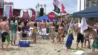 Horny chicks in sexy bikinis getting wild with each other on the beach