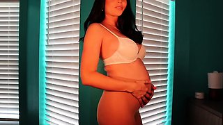 Pregnant busty MILF in nylons brings herself to climax