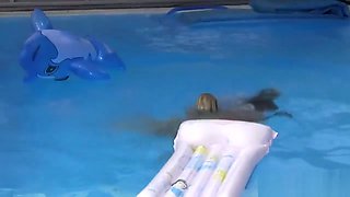 Two young lesbians fuck in the pool