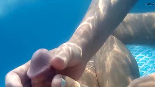 Underwater foot job in backyard pool