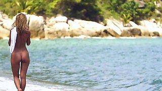 Petite Ukrainian MILF strips at a beach