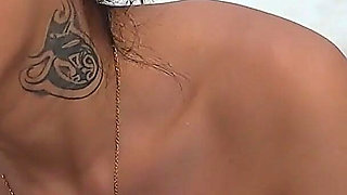 Sexy Tattooed Babe Strips off and Starts Riding a Loaded Rod