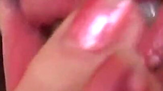 Sexy mature masturbating with her fingers in close up