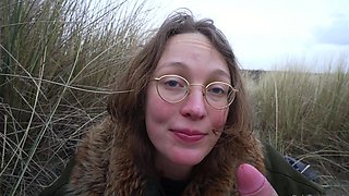 Outdoor handjob on beach with cumshot