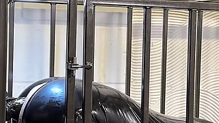 Anal Stretching a Caged Gimp