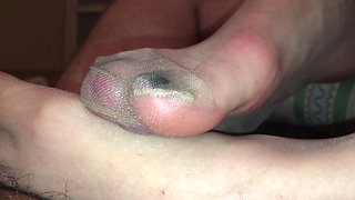 Tan nylons footjob with cock trapped inside