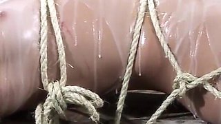 Tied up asian slut wearing glasses gets her pussy rubbed with hitachi by maledom