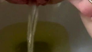 She pees in the toilet beautiful beautiful golden shower on toilet