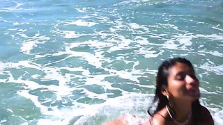 Petite Mexican babe strips at the beach