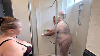 Domina Satana and Satana's piggy in the shower.