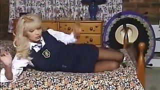 British School Uniformed Slut Plays On Bed With Dildo