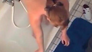 Sexy chubby amateur fucks herself in the bathroom