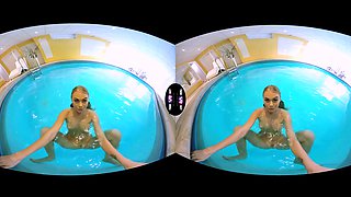Blonde Enjoys Solo Play In A Pool