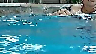 Couple Underwater Diving and Swimming