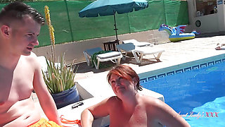 Posh Busty Cougar Jojo Seduces a Stud at the Pool