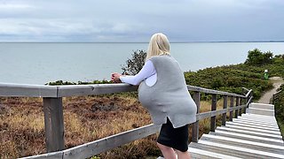 Blonde is flashing her big boobs in the outdoors