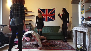Masked slave gets punished from three femdom chicks