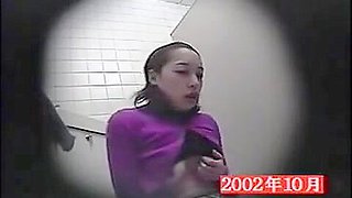 Voyeur in a public toilet exposing cunt playing