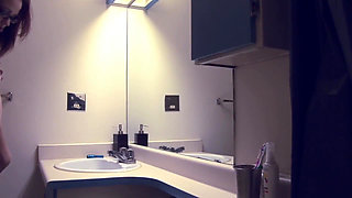 Skinny redhead teen in bathroom