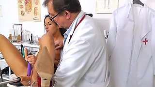 Busty girl in uniform masturbating with vibrator on the airb