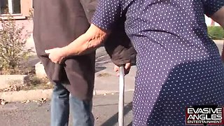Hot Granny with Glasses and Stockings Gets Her Big Tits Sucked by Black Caregiver