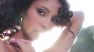 Curly latina teen posing naked outdoor