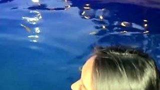 Exotic bombshell performs sensual striptease in the pool
