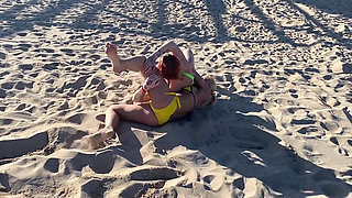 Two Lesbian Hotties Wrestling on the Beach and After That Start Kissing