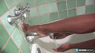 Bare legs in the bath