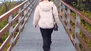 Slutty redhead gives a nice blowjob to an older guy outdoor and takes his cum in her mouth