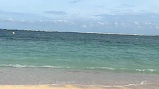 Teasing on the Beach in Micro Bikini on the Sand