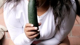 Alone at home putting a cucumber