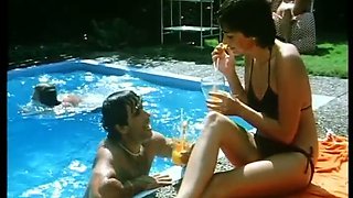 Short haired lean busty babe by the pool sucking dick