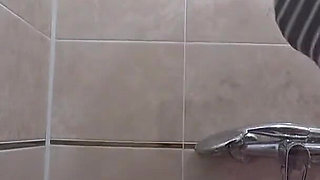 The camera is watching a mature chubby milf in the shower. Gorgeous fat ass, big natural boobs, hairy pussy. PAWG.