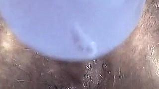 Extreme Close-up of Wet Hairy Vagina with Dildo