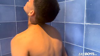Cute young babe latino boy doing striptease in shower