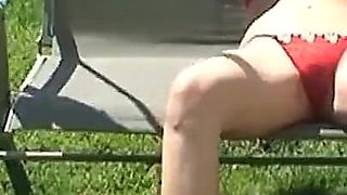 A blonde masturbates with her sex toy in the garden enjoying like a slut