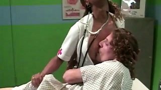 Ebony Nurse Sees to Patient
