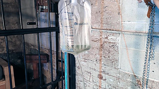 Chained to the Wall for Enema and Electrics
