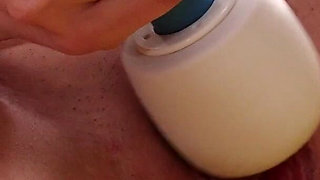 Dark haired teen makes herself squirt