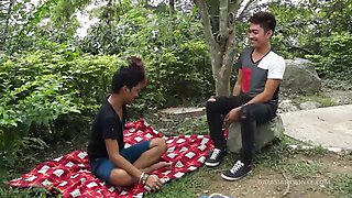 Two cute Asian twinks Idol and Nathan find the outdoors exhilarating and make them horny. No one is around so they start kissing on a blanket. Soon they are naked and sucking each others cocks and enjoying a rimming on the ass.