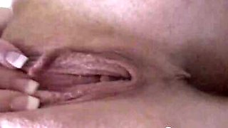 Closeup of a beautiful babe masturbating sensually